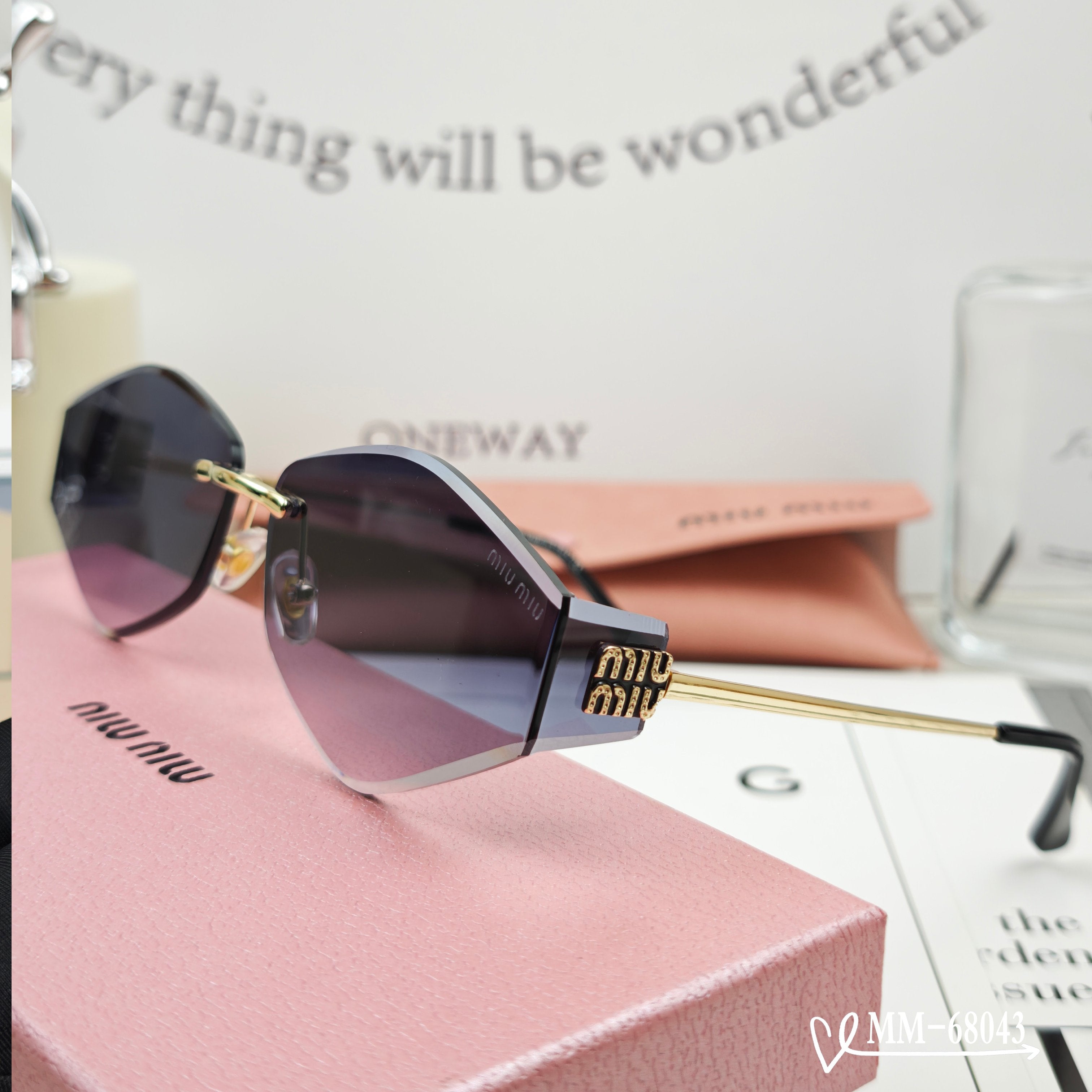 MIU MIU LOGO SUNGLASSES 68043 IN GOLD METAL GREY LENS