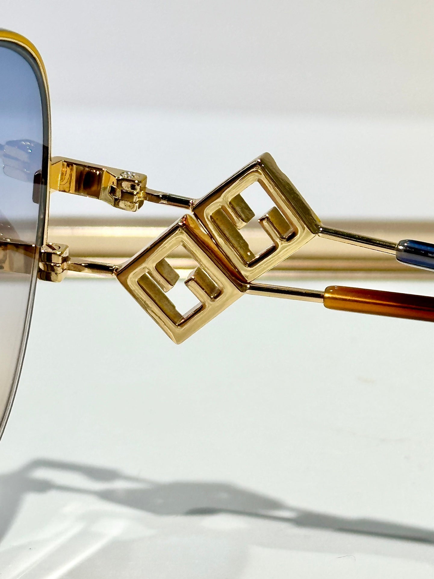 FENDI TRAVEL ROUND FRAME SUNGLASSES FD8136 IN METAL