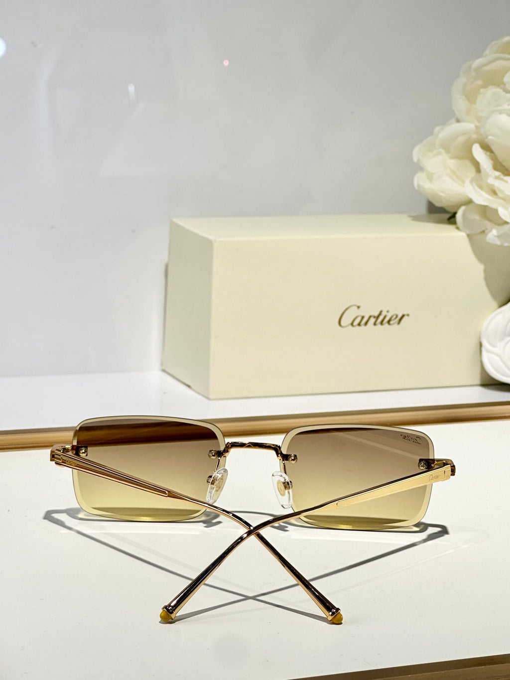CARTIER RIMLESS SQUARE FRAME SUNGLASSES CT0610S IN METAL