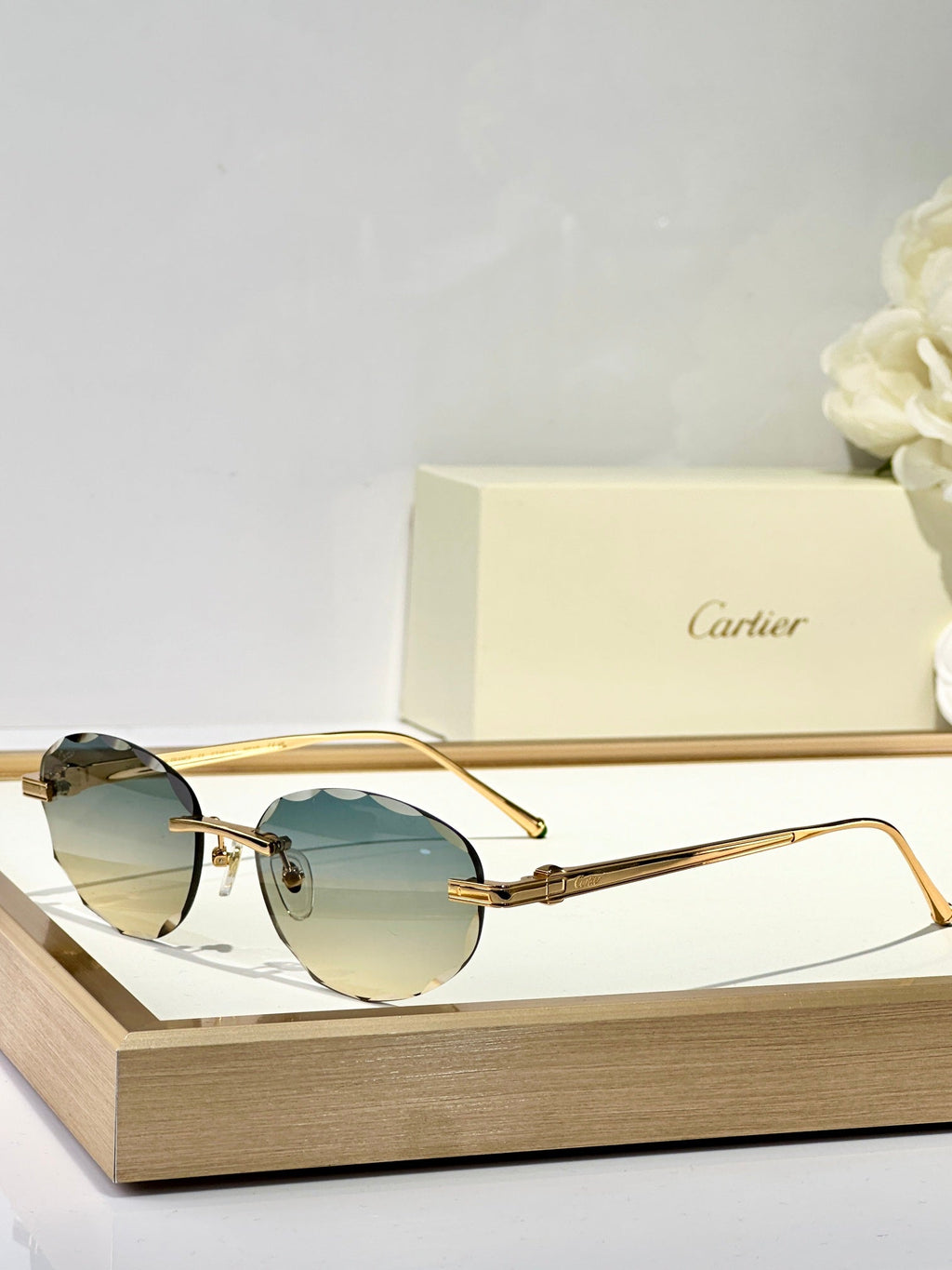 CARTIER RIMLESS ROUND FRAME SUNGLASSES CT0611S IN METAL