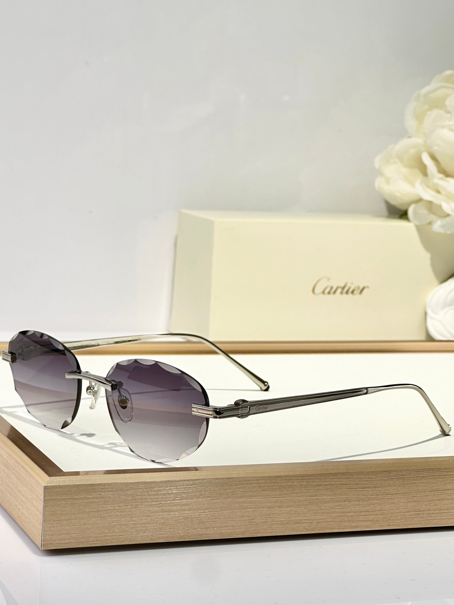 CARTIER RIMLESS ROUND FRAME SUNGLASSES CT0611S IN METAL