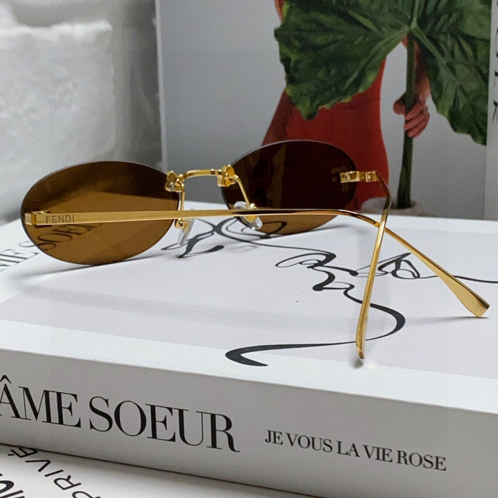 FENDI FIRST CRYSTAL RIMLESS OVAL FRAME SUNGLASSES 557152 IN METAL
