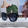 MIU MIU LOGO CAT EYE SUNGLASSES 513005 IN BLACK ACETATE