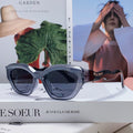 MIU MIU LOGO CAT EYE SUNGLASSES 513006 IN BLACK AND GREY CLEAR ACETATE WAVY FRAME