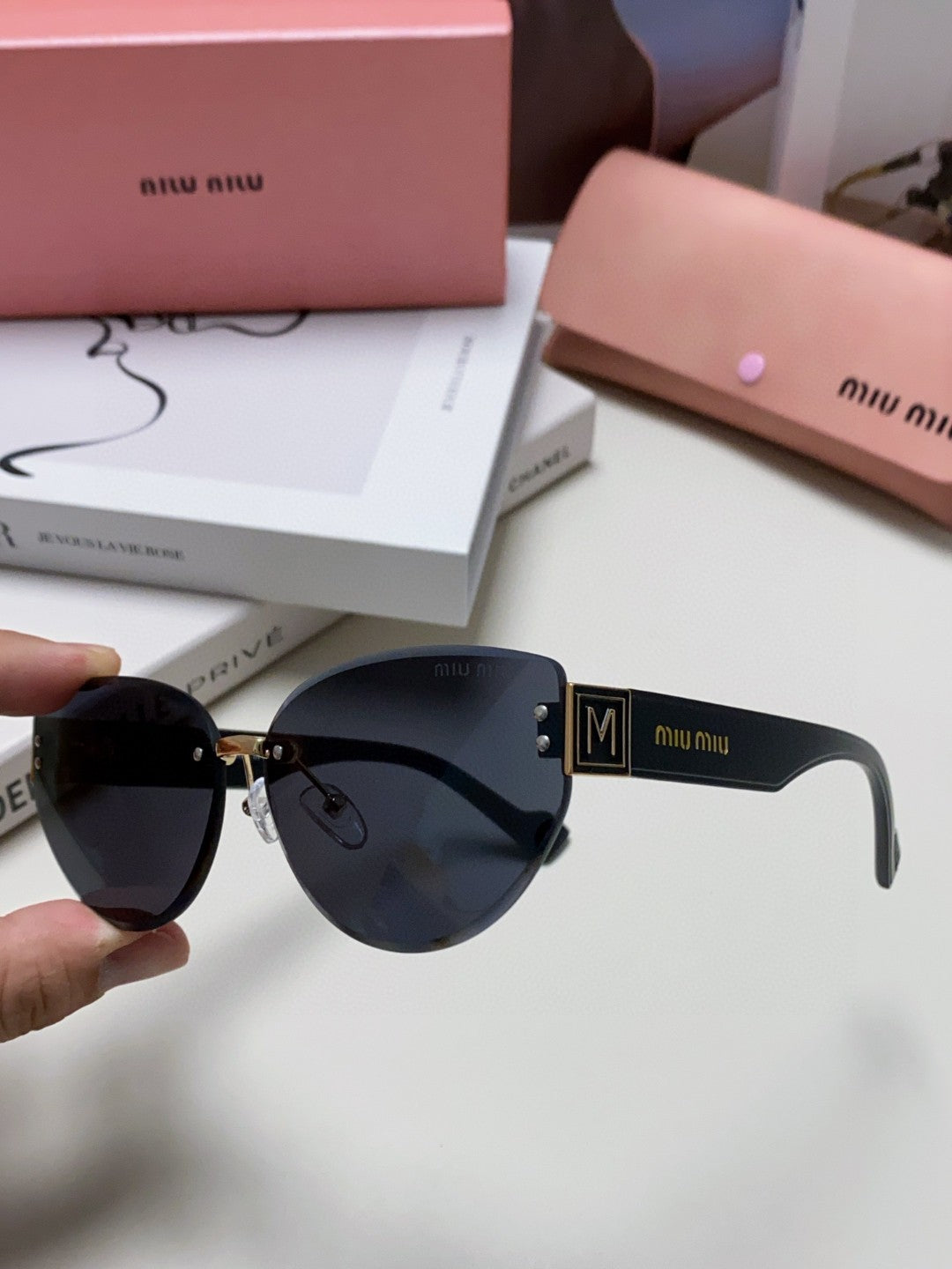 MIU MIU LOGO SUNGLASSES 513013 IN BLACK ACETATE