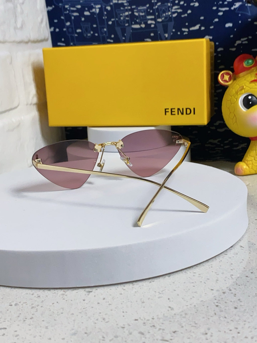 FENDI SKY RIMLESS TRIANGLE FRAME SUNGLASSES 566724 IN METAL