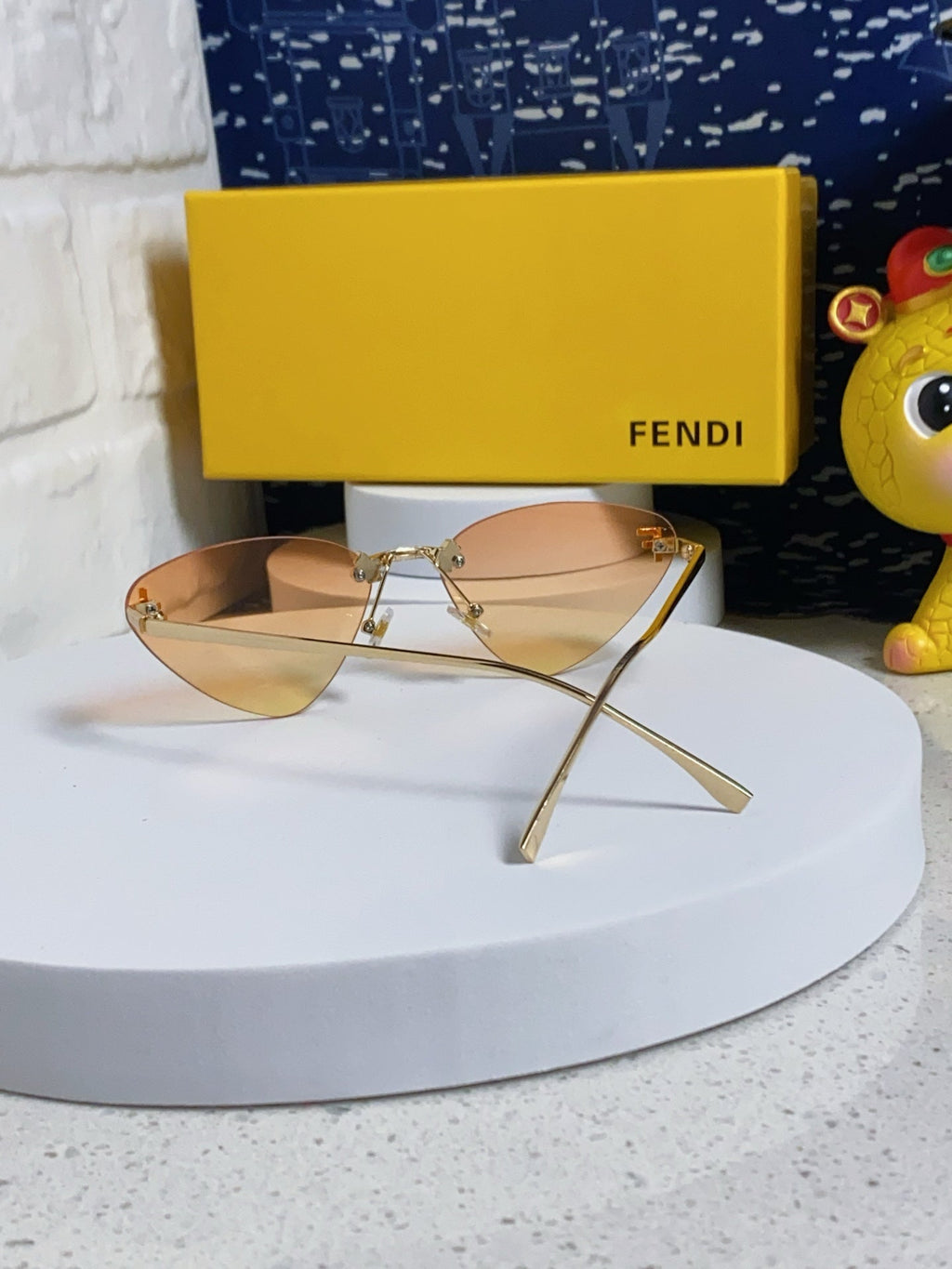FENDI SKY RIMLESS TRIANGLE FRAME SUNGLASSES 566724 IN METAL