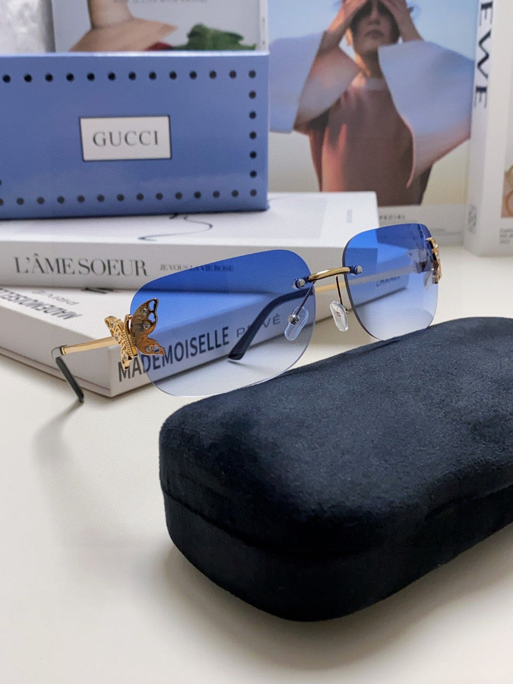 GUCCI BUTTERFLY EMBELLISHED RIMLESS RECTANGULAR FRAME SUNGLASSES 570245 IN METAL