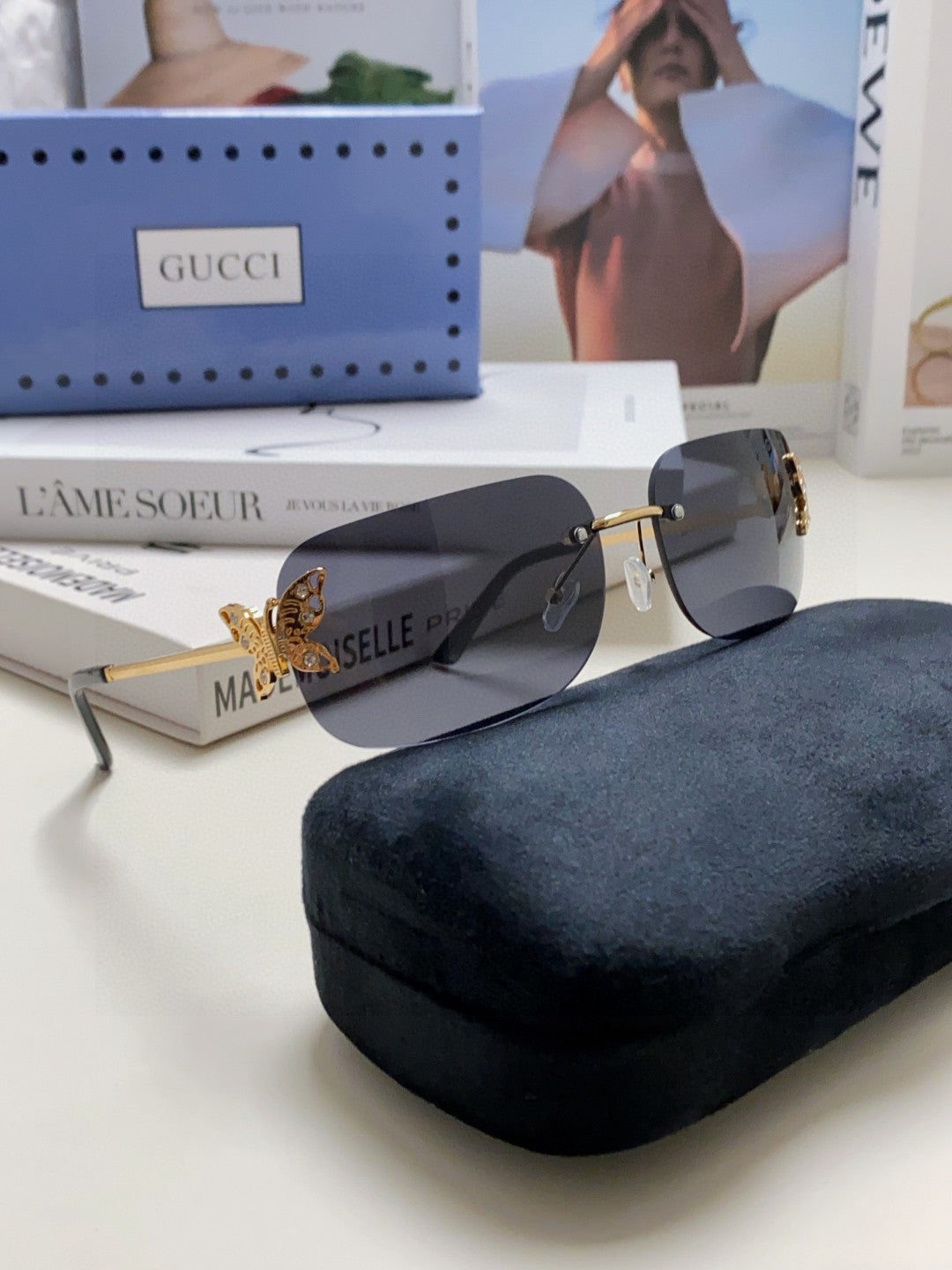 GUCCI BUTTERFLY EMBELLISHED RIMLESS RECTANGULAR FRAME SUNGLASSES 570245 IN METAL
