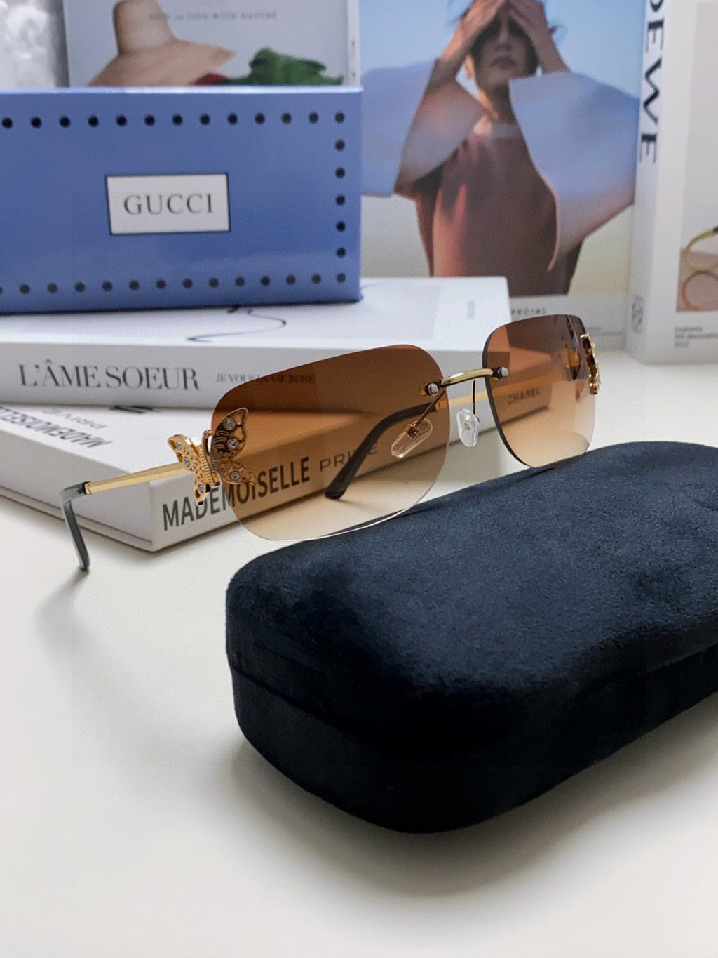 GUCCI BUTTERFLY EMBELLISHED RIMLESS RECTANGULAR FRAME SUNGLASSES 570245 IN METAL