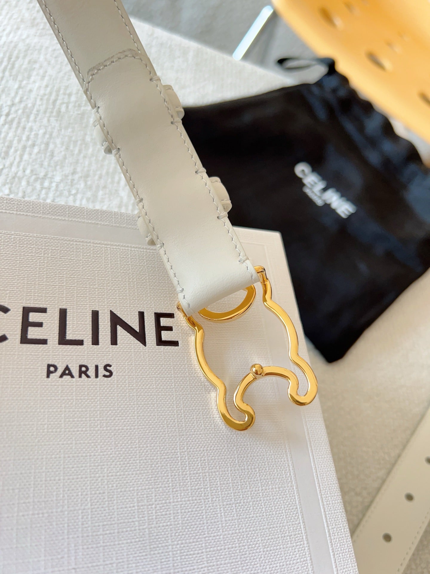 CELINE BELT 25MM TRIOMPHE LOGO CUT-OUT IN WHITE SMOOTH CALFSKIN WITH GOLD BUCKLE