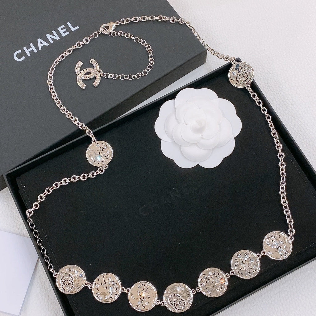 CHANEL TWISTED CHAIN BELT WITH RHINESTONES AND LOGO PLATE IN SILVER TONE