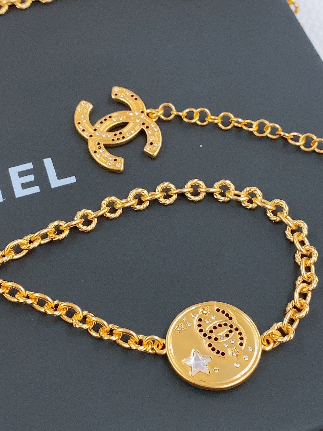 CHANEL TWISTED CHAIN BELT WITH RHINESTONES AND LOGO PLATE IN GOLD TONE