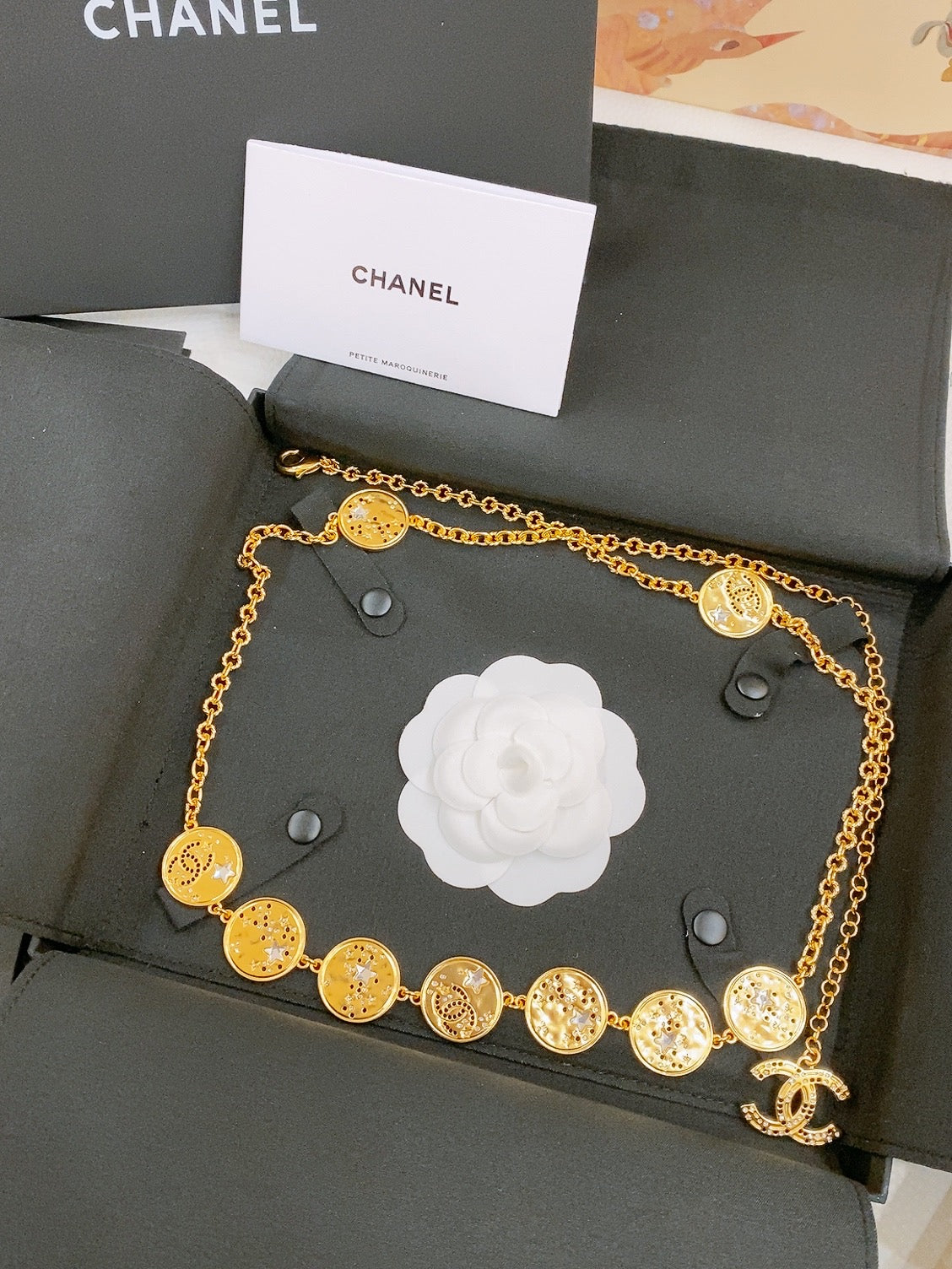 CHANEL TWISTED CHAIN BELT WITH RHINESTONES AND LOGO PLATE IN GOLD TONE